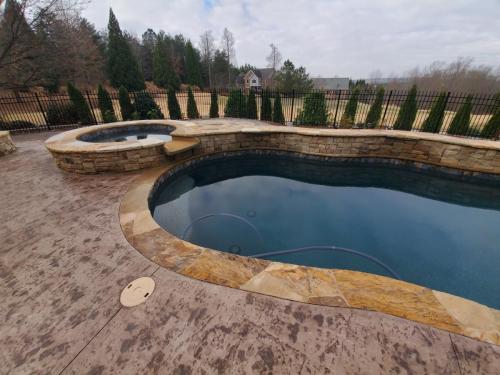 Brown Flagstone and Stamped Concrete, Midnight Blue Regular pebble with Touch of Glass