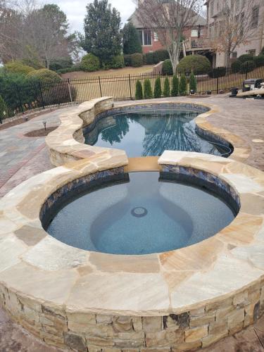 Brown Flagstone and Stamped Concrete, Midnight Blue Regular pebble with Touch of Glass