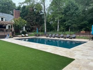Ivory travertine Coping and Pavers, Midnight Blue mini pebble