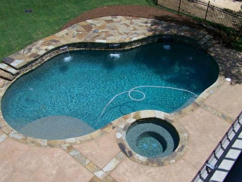 Brown Flagstone, stacked Stone, Cool decking with decorative stone ribbons