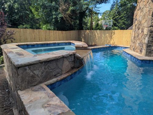 Raised pool/spaFlagstone Coping/wallAqua Blue Mini pebble